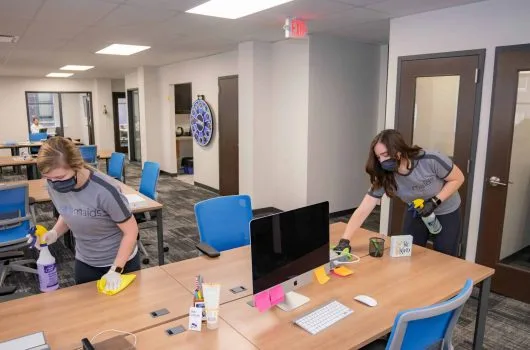 Team cleaning office