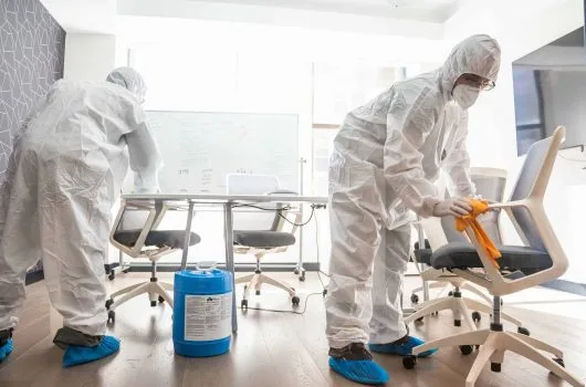 Team disinfecting chairs